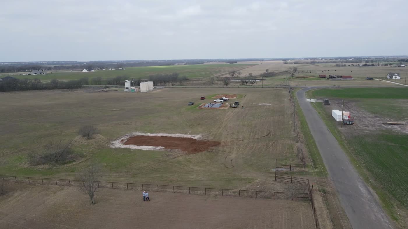 Aerial view of community land and fields